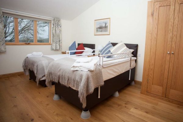 Bed risers for accessible guests at Wallops Wood Cottages