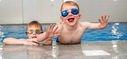 George and William having fun at Wallops Wood Cottages pool