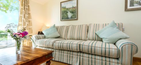 Hedgehunter Cottage at Wallops Wood living room is plush and comfy