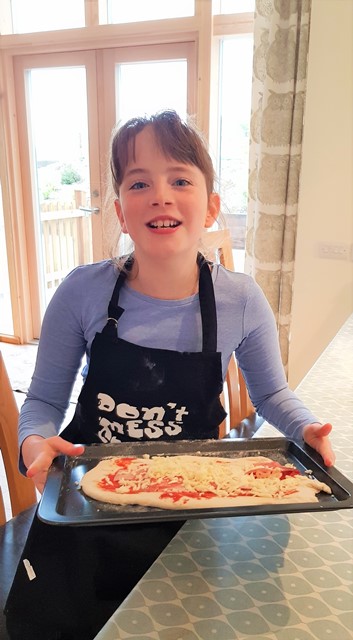 Sophie and her pizza making experience at Wallops Wood Cottages