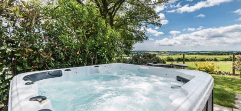 Bubbling hot tub with views over the Meon Valley