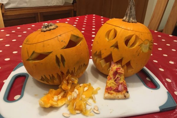 Two pumpkins carved in spooktacular style from last year's pumpkin carving competition
