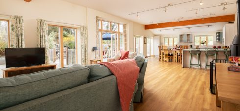 Huge open plan living area in Silver Birch with patio doors to the wraparound patio and hot tub, kitchen-dining area, breakfast bar, seating area and contemporary woodburner makes this large self catering cottage ideal for group accommodation